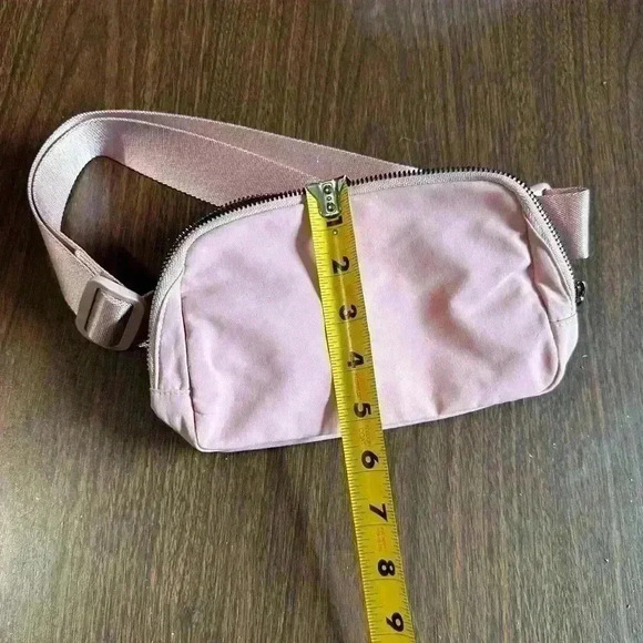 Light Pink Fanny Bag. Zip Closure. Pockets. Adjustable. 5”x9”. - Picture 7 of 8